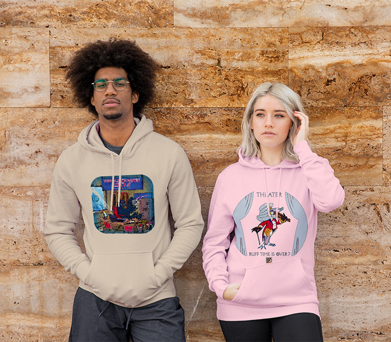 Man and woman wearing hoodies with a bird image